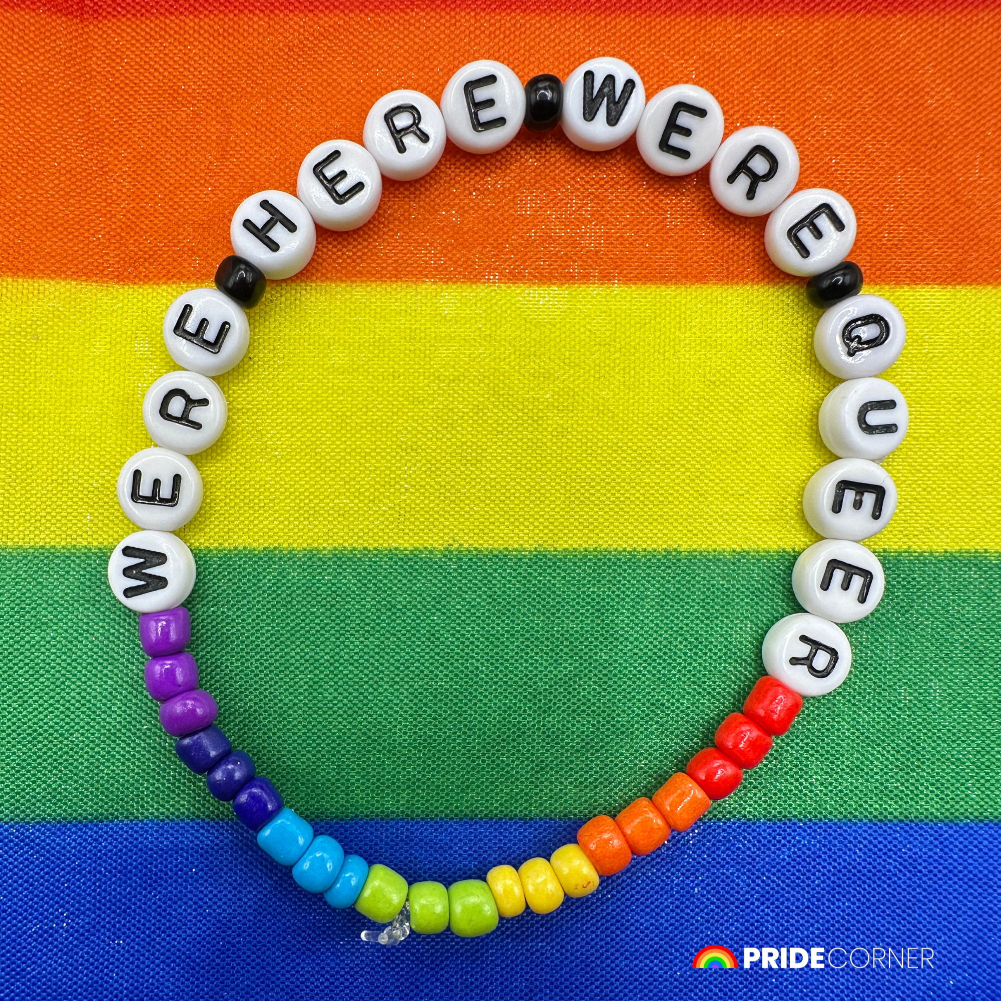 “We’re Here, We’re Queer” Beaded Rainbow Bracelet | LGBTQIA+ Inclusive Pride Jewellery